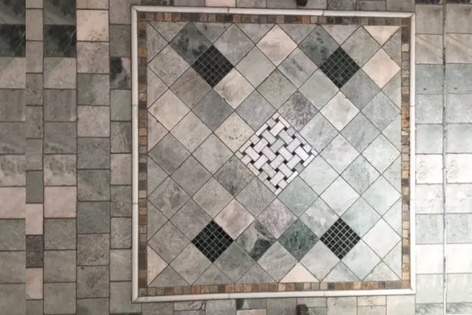 Detail of a diamond-pattern marble mosaic tile panel