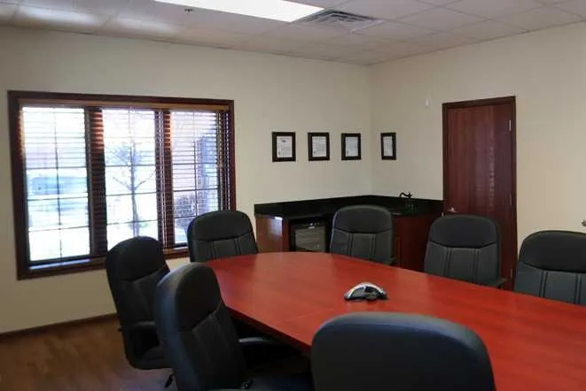 Conference room with a long table and executive seating