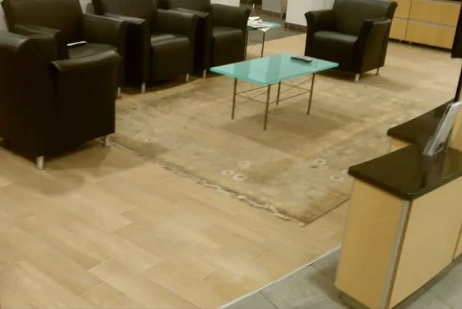 Waiting lounge with a stone-topped reception counter