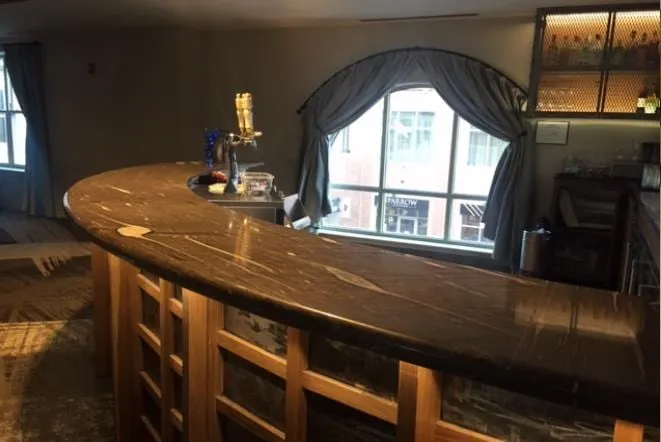 Round bar with a stone top and wood base